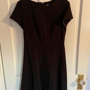 Navy blue dress falls just at the knees